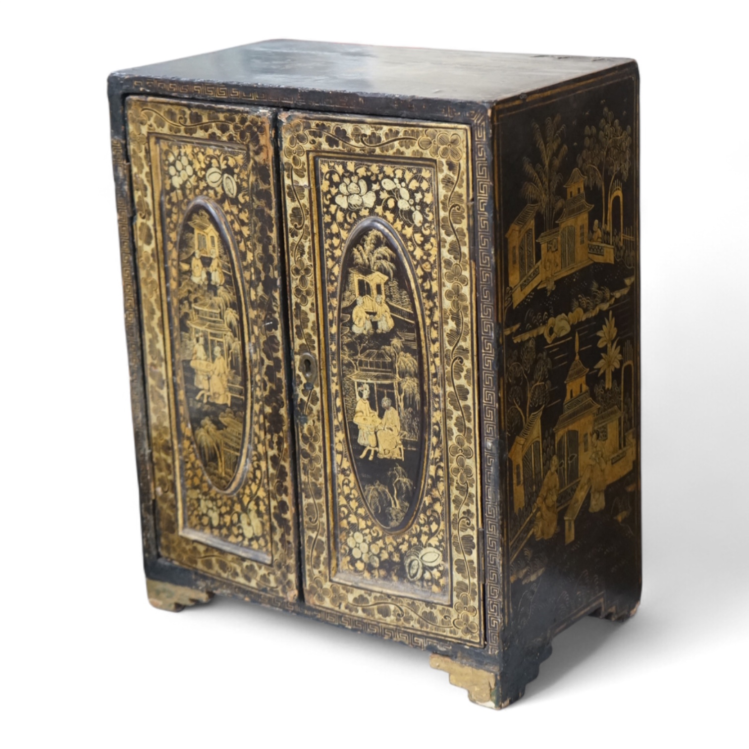 A mid 19th century Chinese export gilt-decorated lacquer two door cabinet, with five drawers, 38cm